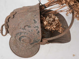 Time-worn nautilus shell coal hod