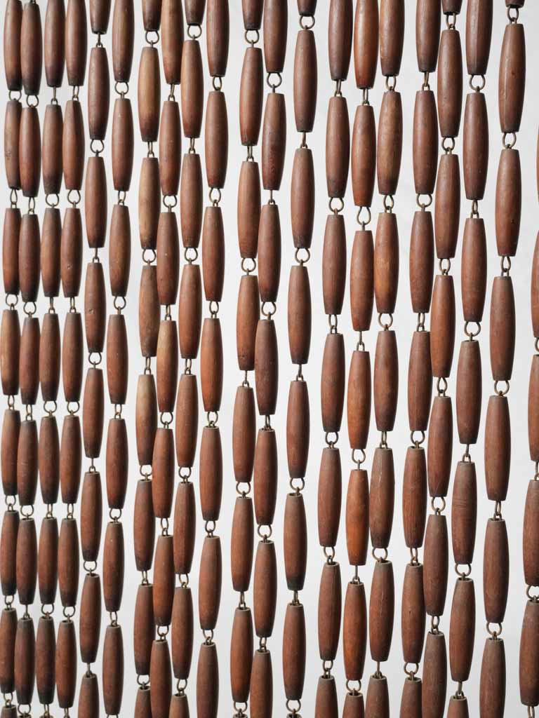 Artisanal torpedo-shaped beaded curtain