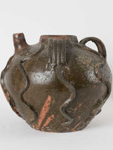 Decorated 19th-century walnut oil pitcher