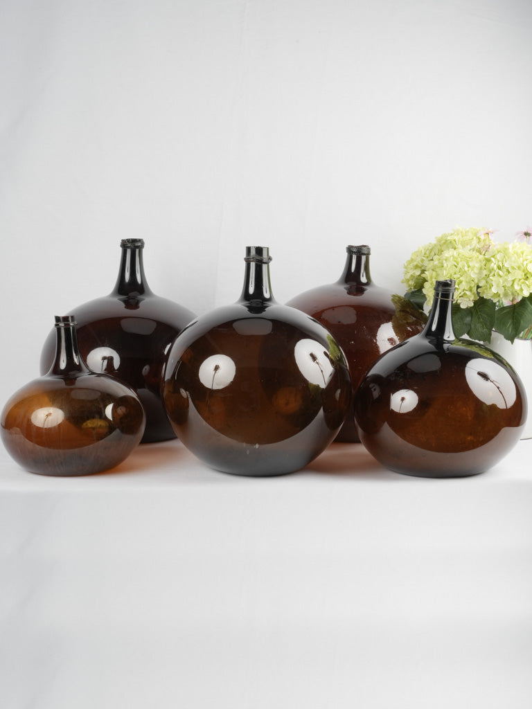 Aged provincial French glass demijohn