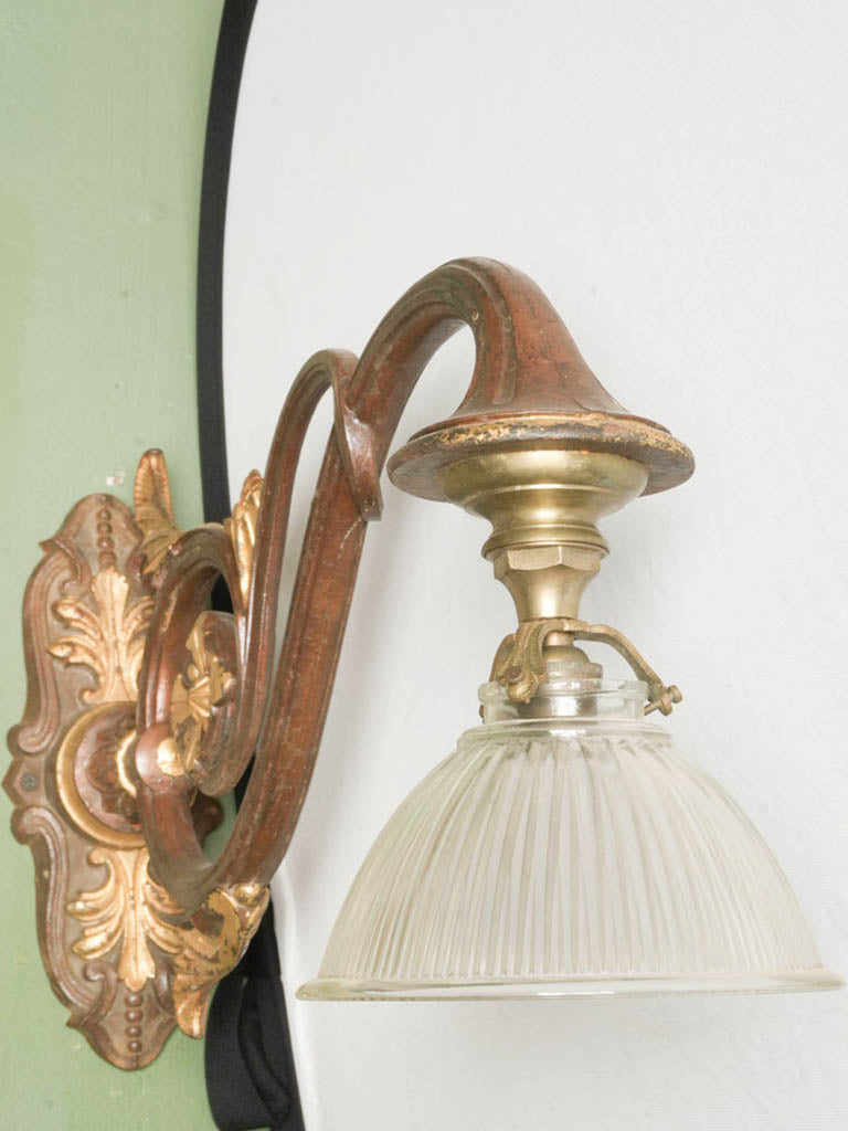 Gilt-highlighted scrolled arm sconce  