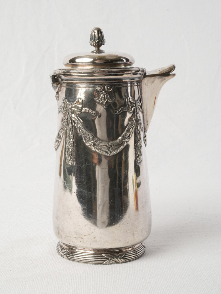 Wooden-handled silver drink server  