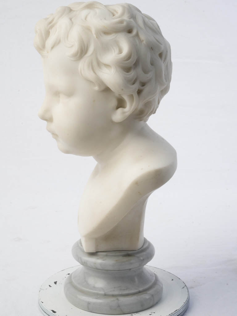 Cherubic child marble statue