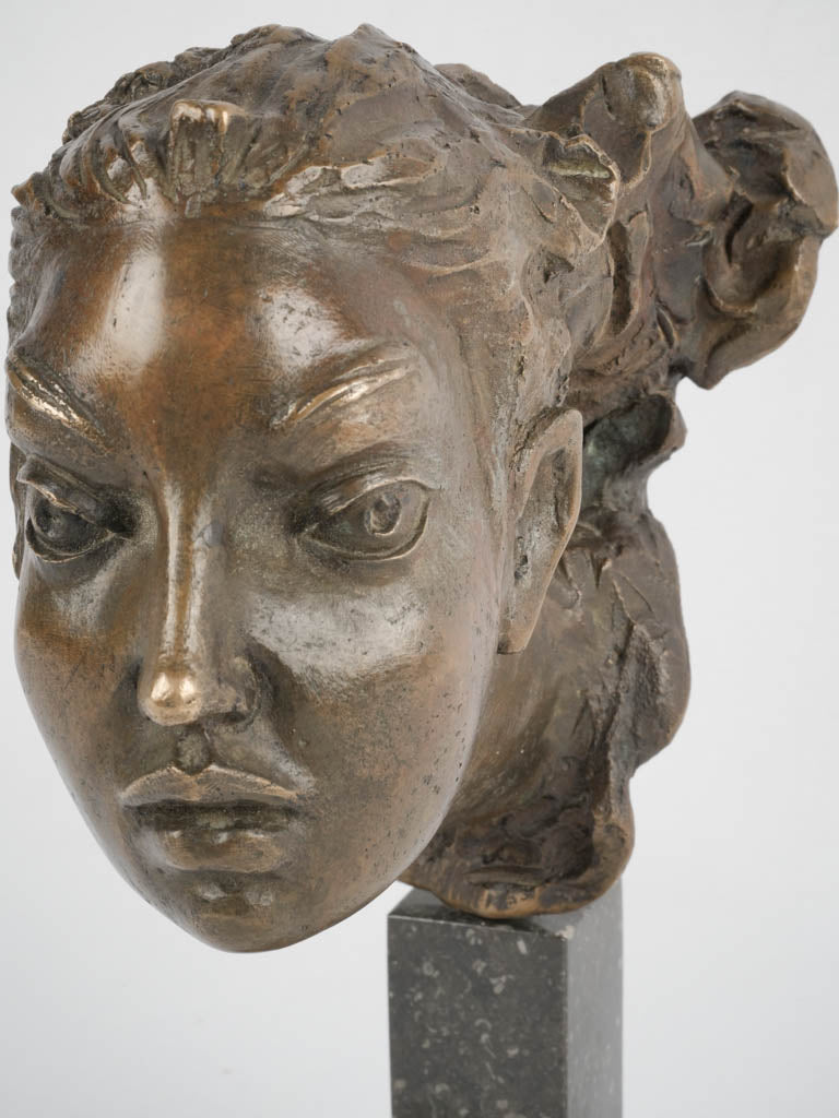 Early-century serpent-decorated statuette
