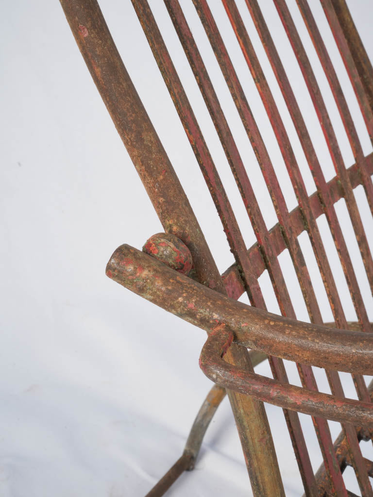 Weathered iron folding armchair