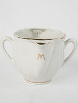 Intricate, antique white porcelain sauceboat