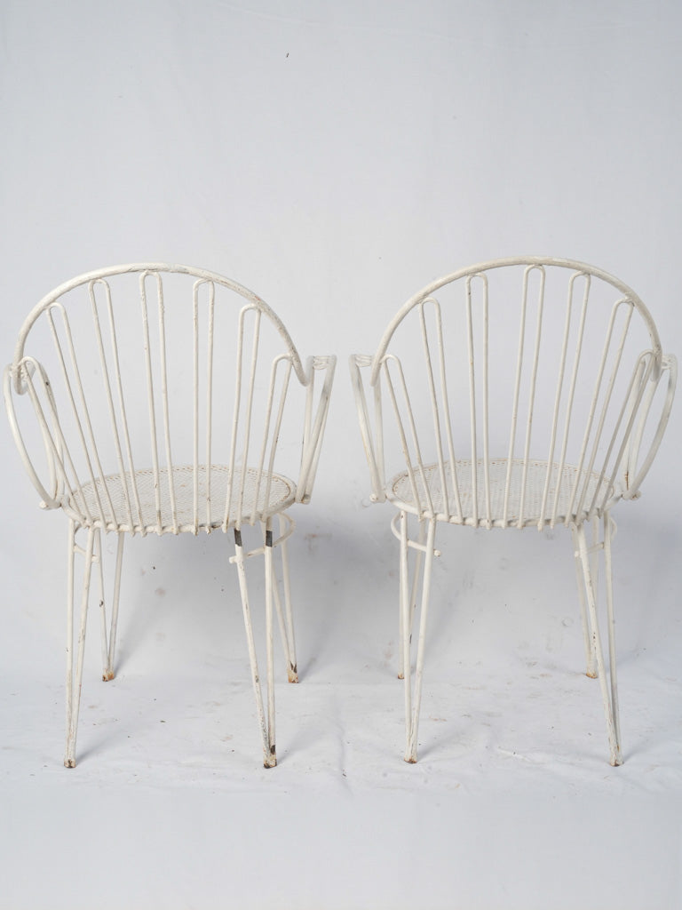 Whimsical vintage French iron chairs