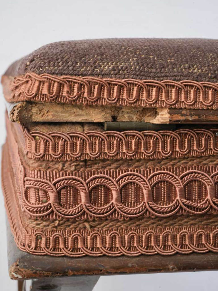 Worn antique footstool with storage  
