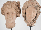 Charming terracotta busts, mounted duo