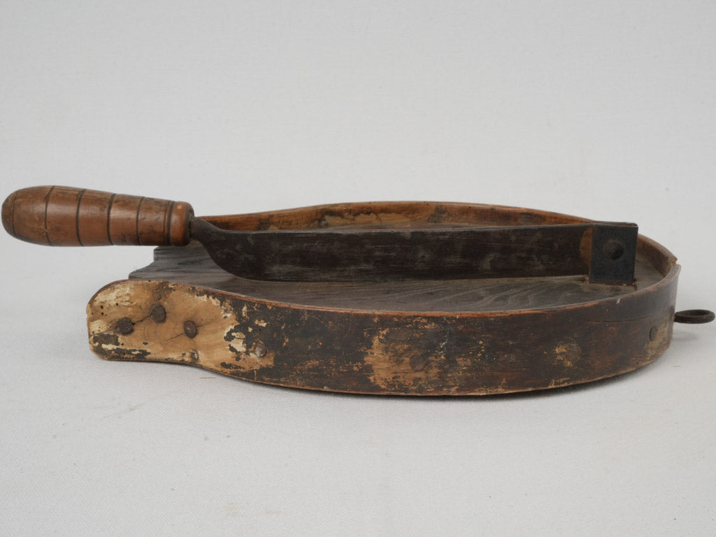 Traditional, weathered chocolate preparation implement