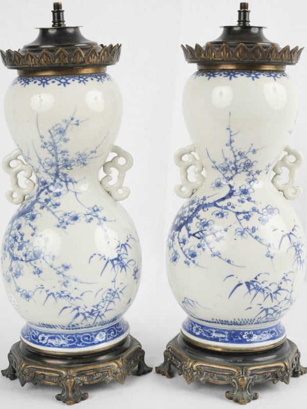Antique blue-and-beige earthenware oil lamps