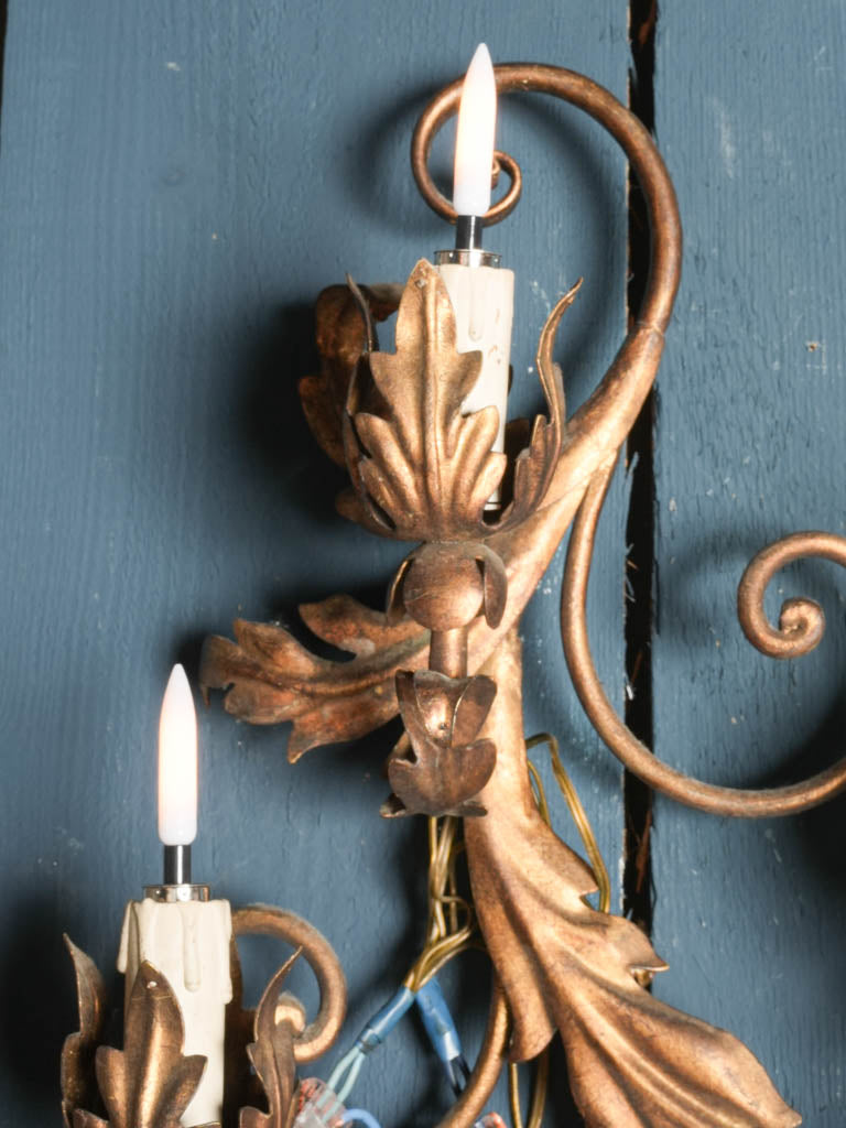 Timeworn gilded wall-mounted lights  