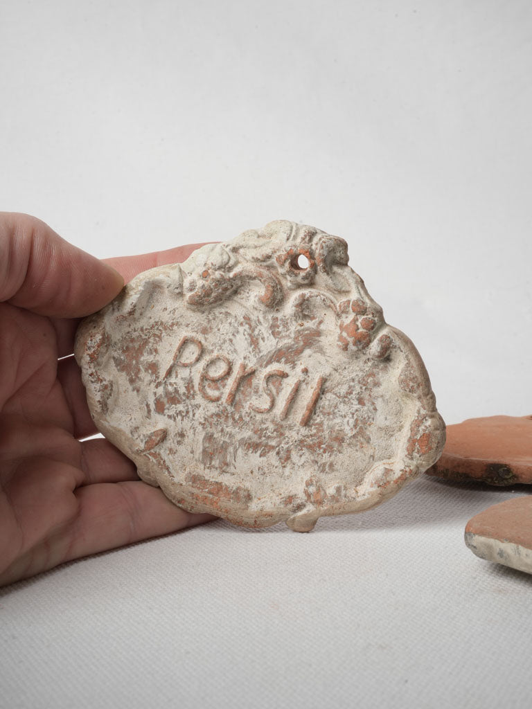 Decorative foliate scroll clay identifiers