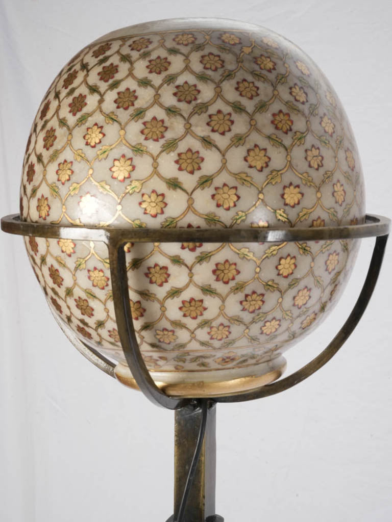 Richly ornamented globe torchère lamps  