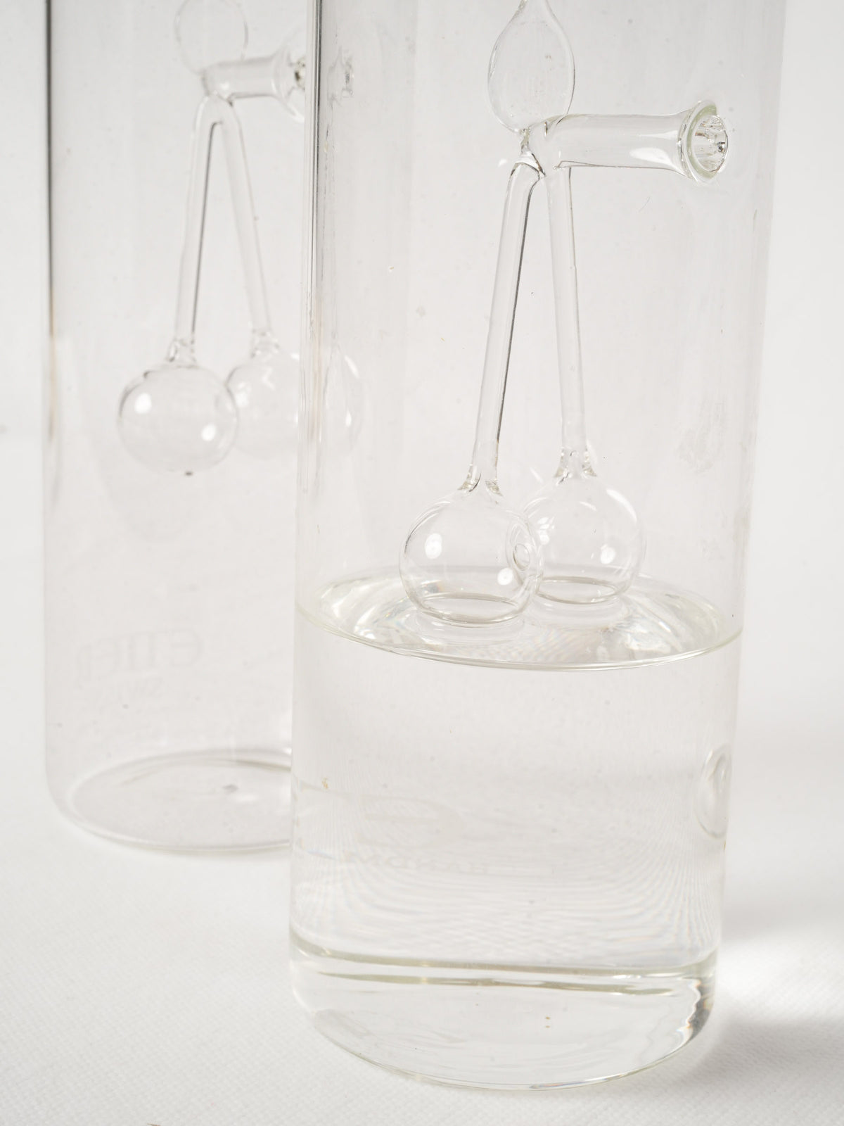 Pair of Swiss Blown Glass Kirsch Carafes with Cherry Sculpture