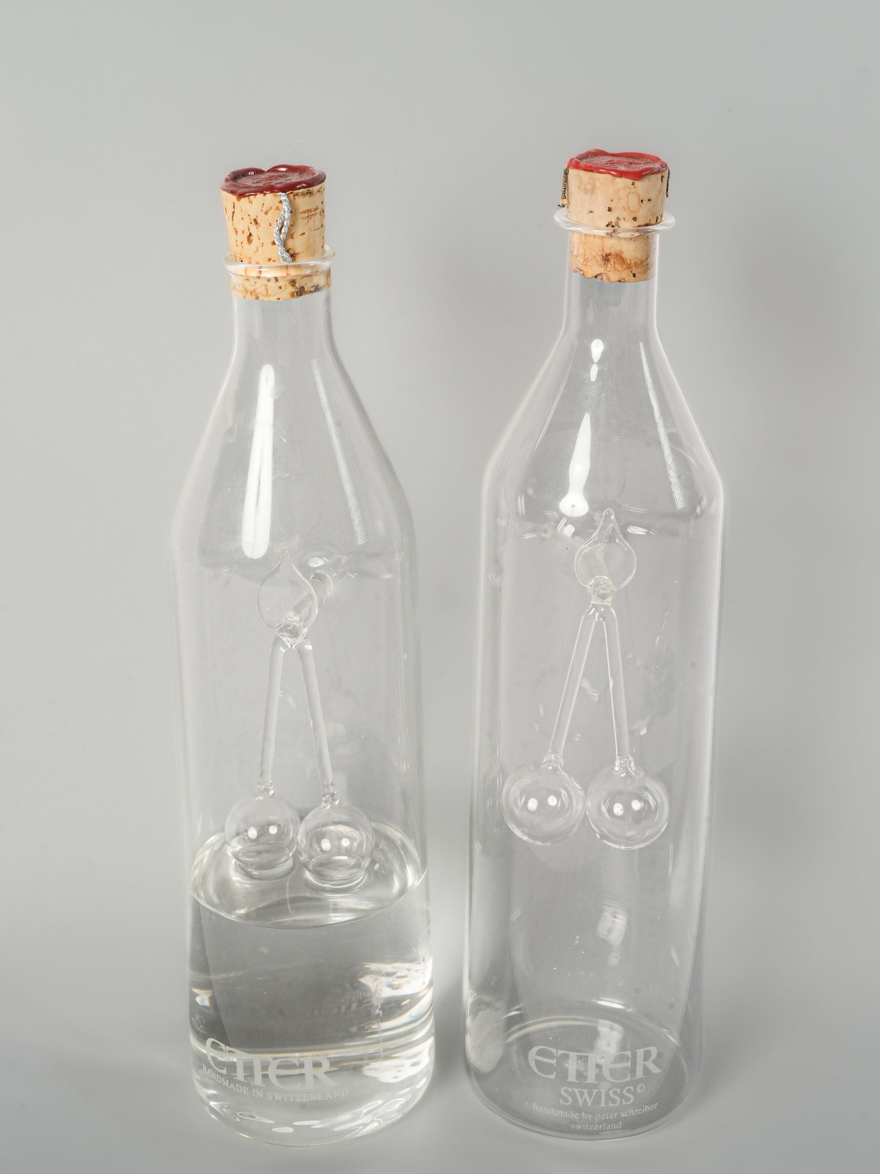 Pair of Swiss Blown Glass Kirsch Carafes with Cherry Sculpture