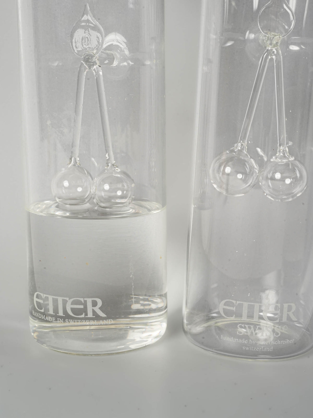 Pair of Swiss Blown Glass Kirsch Carafes with Cherry Sculpture