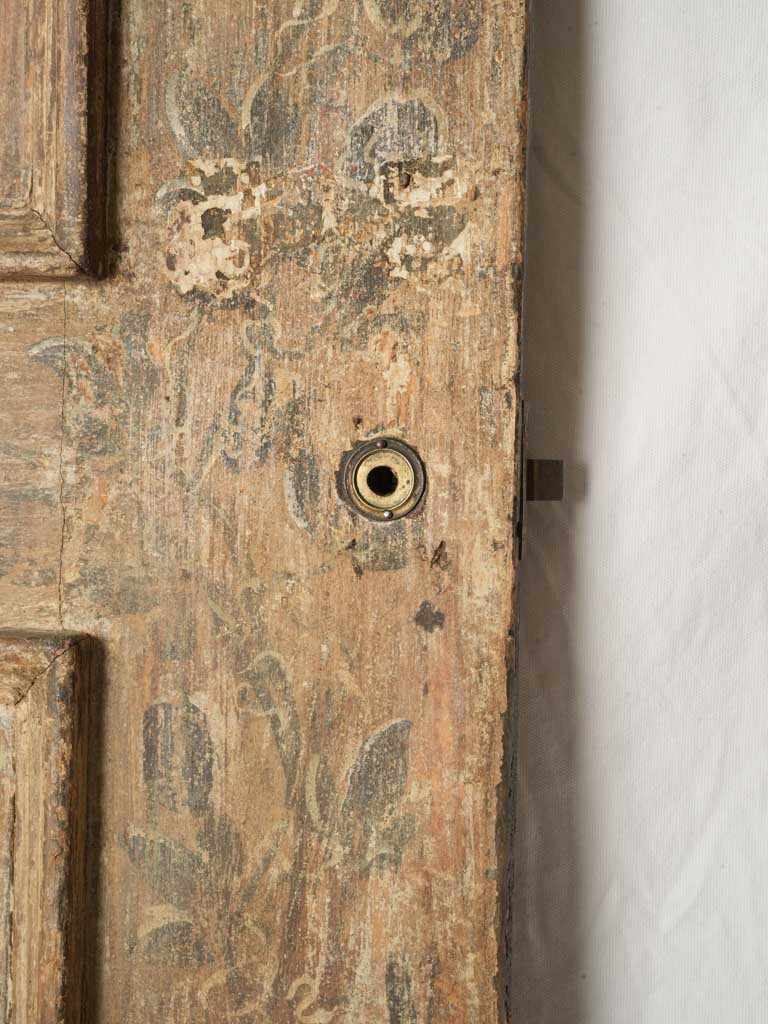 Vintage rosette-enriched Florentine door