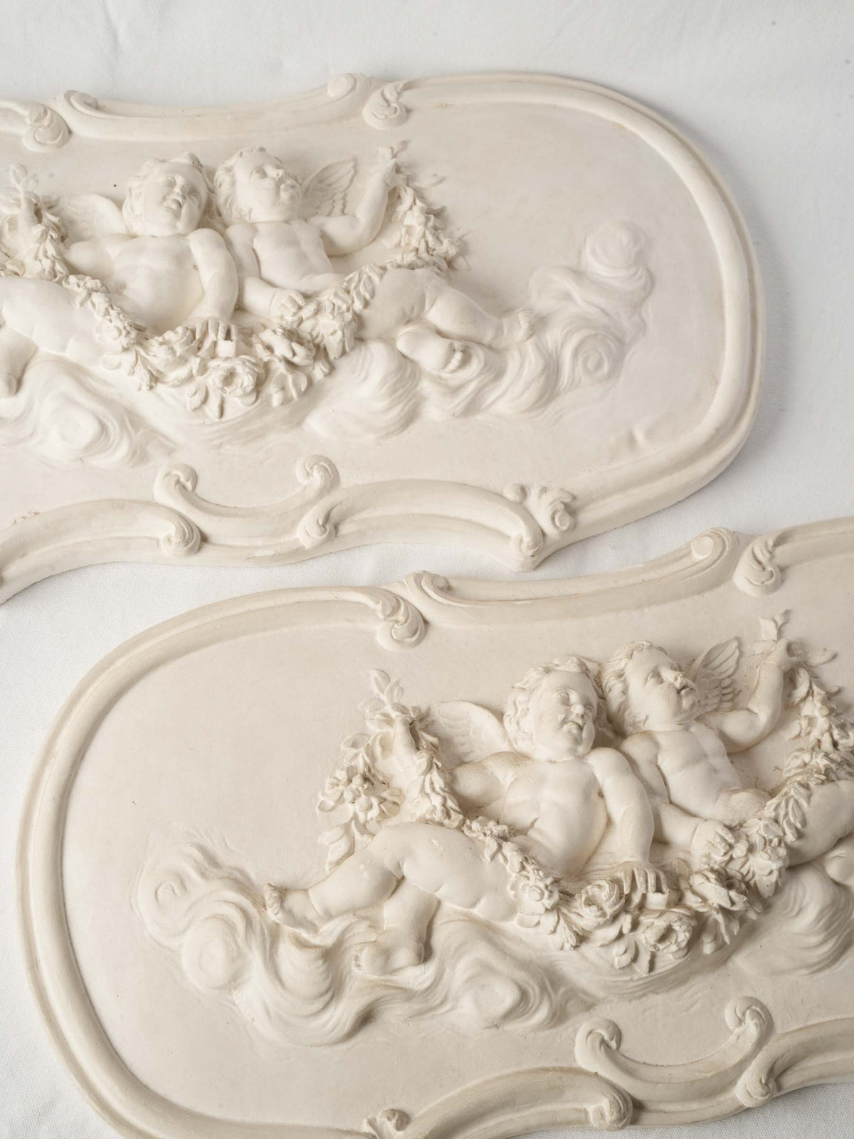 Pair of French Plaster Overdoor Panels with Cherubs, circa 1900 - 14½" x 27½"