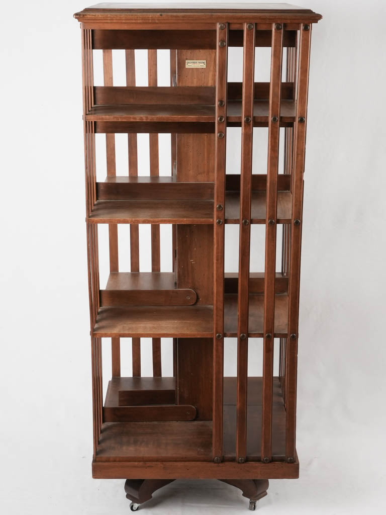 Classic walnut-crafted rotating bookcase 1900s