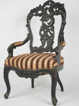Antique carved walnut Napoleon armchair