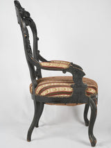 Intricate walnut craftsmanship Napoleon chair