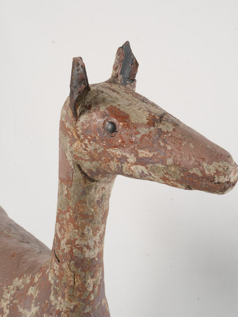 Weathered reinforced concrete deer figure