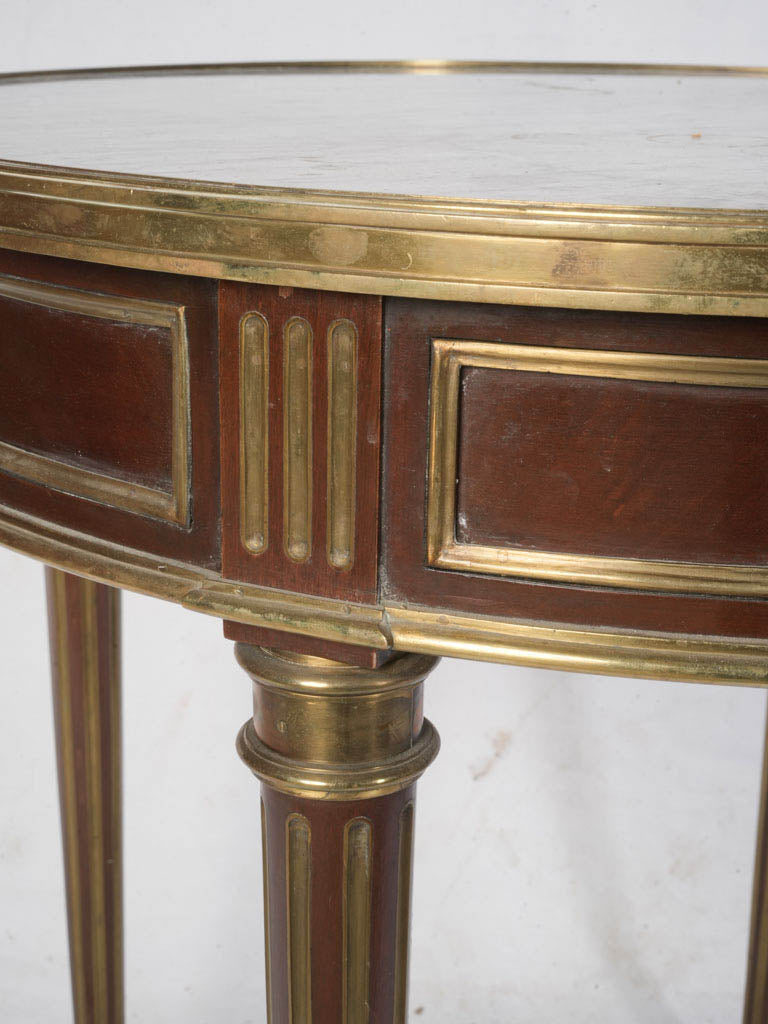 Warm patina brass gallery table  