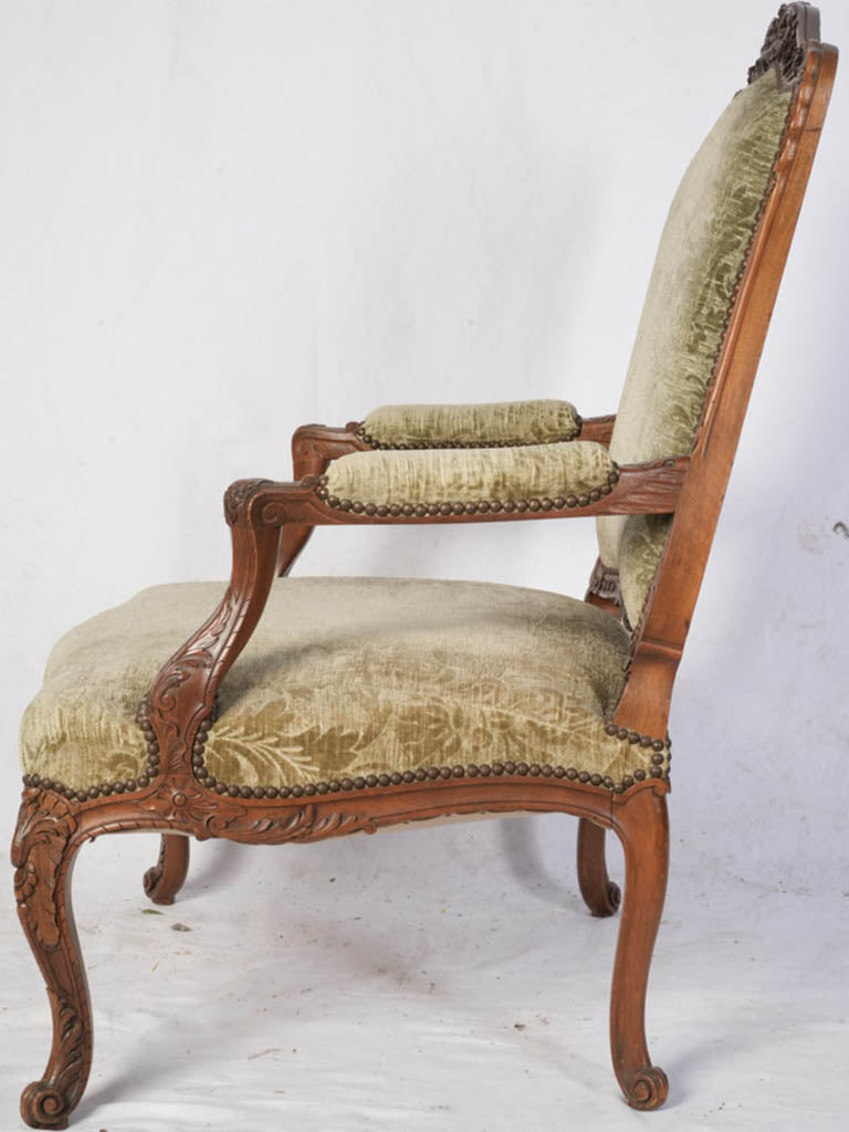 Ornately crafted walnut armchairs