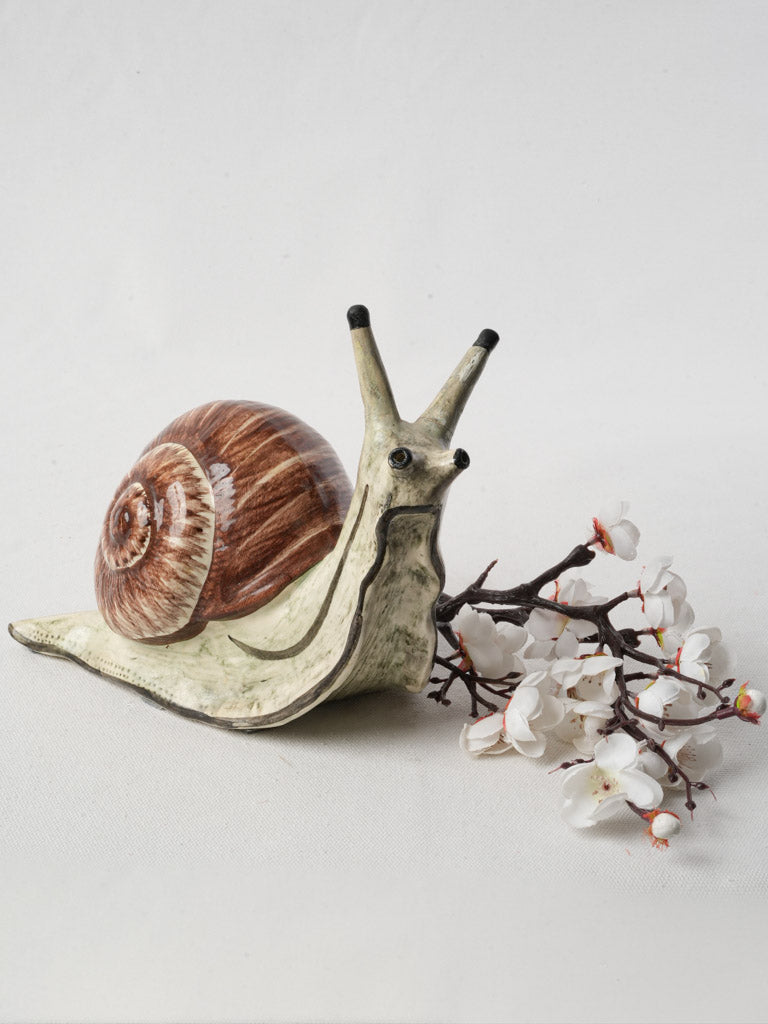 Elegant French barbotine snail artwork