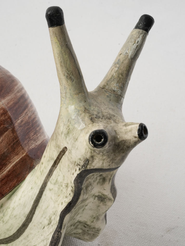 Realistically colored snail faïence creation