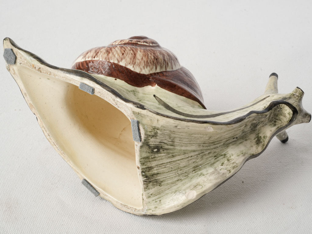 Expressive mid-century snail artifact