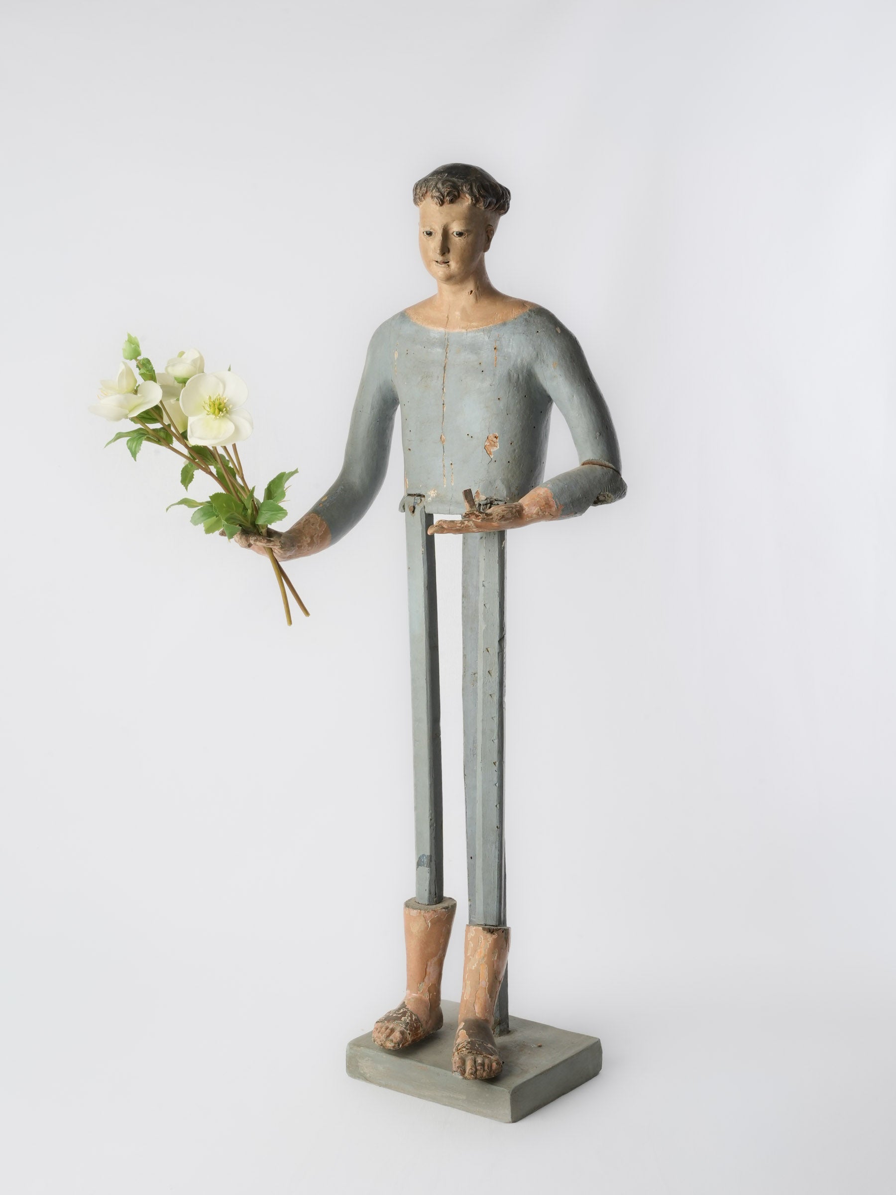 Expressive glass-eyed Capipote statue