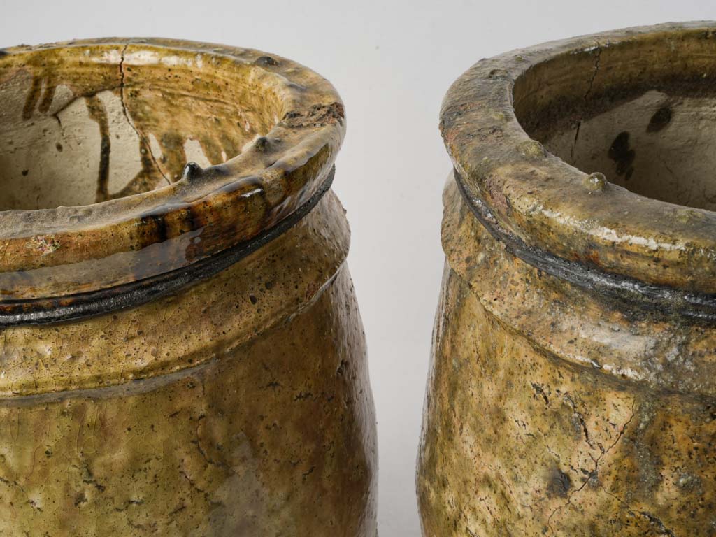 Sculptural olive green urns  