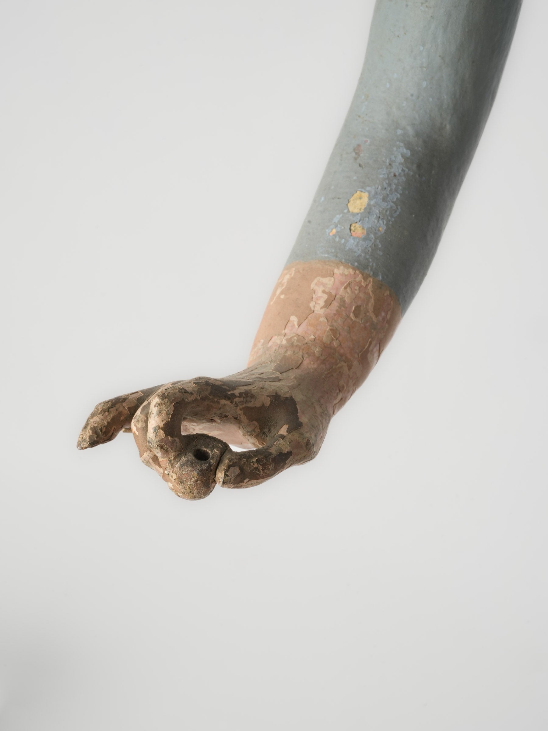 Naturalistic paint-worn Capipote statue