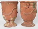 Set of weathered terracotta garden urns