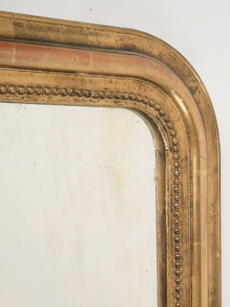 Sophisticated foxed glass mirror  