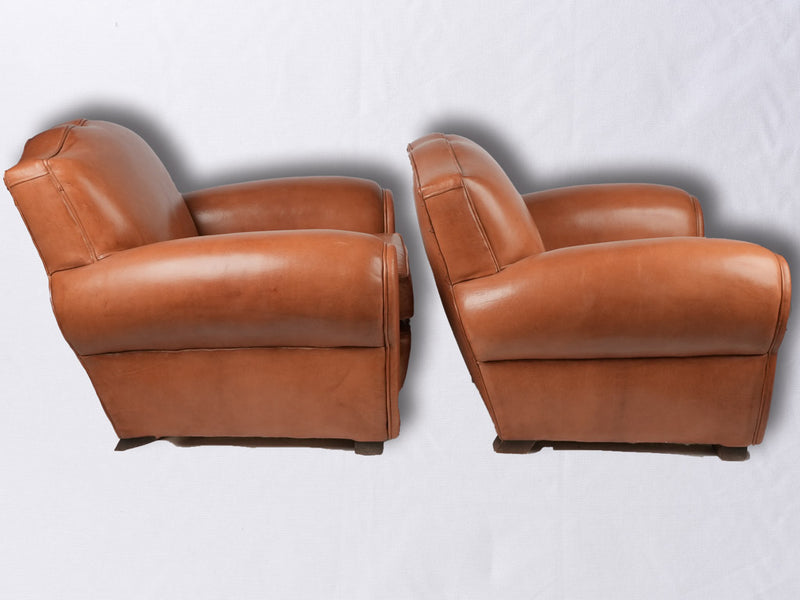 Pair of French leather club chairs - Moustache back