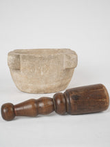 Aged stone and wooden pestle