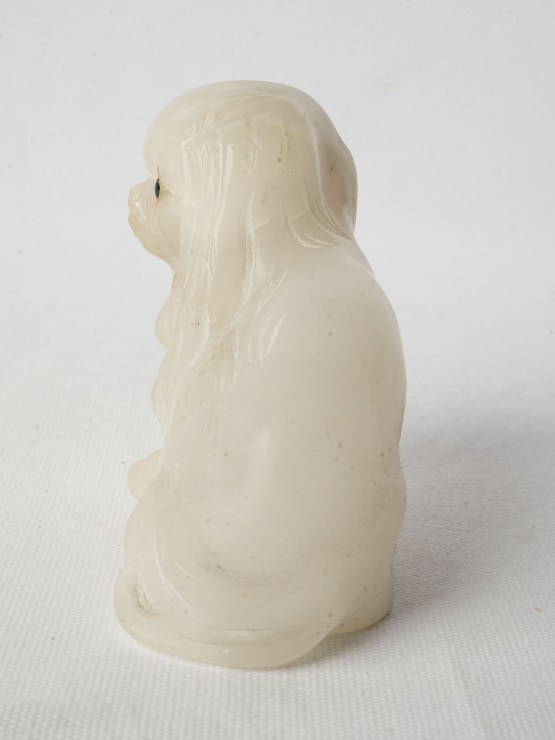 Finely carved alabaster dog figure