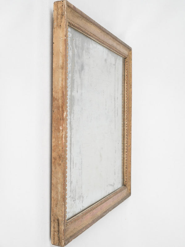Aged pearl-detailed Louis XVI mirror