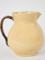 Antique yellow-glazed French pottery pitcher