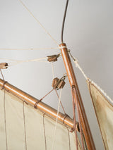 Weathered, elegant French sailboat replica