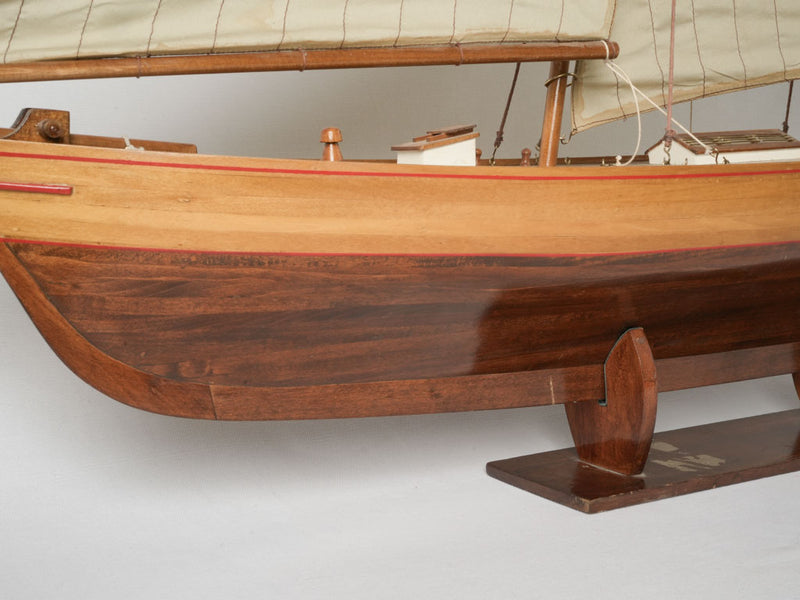 Weathered, classic wooden model sailboat