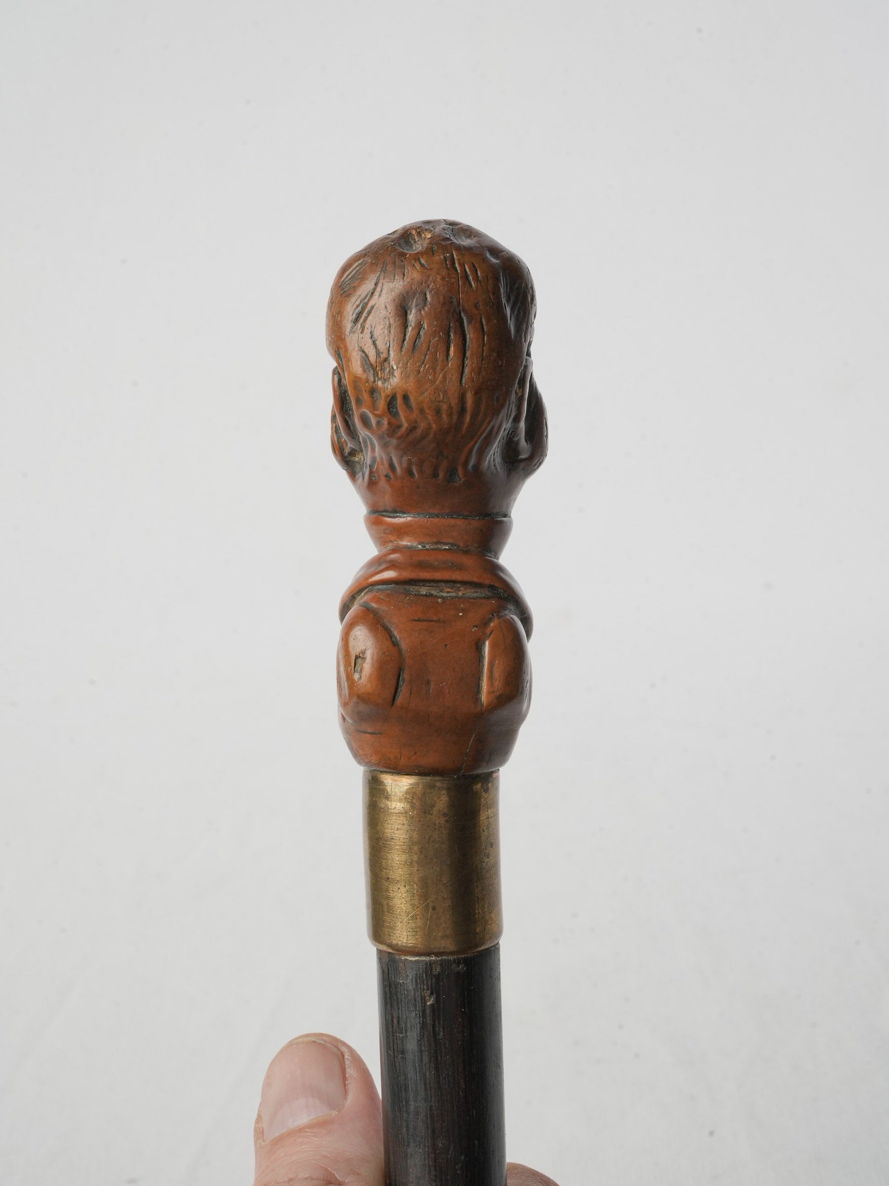 Satirical figural handle accessory