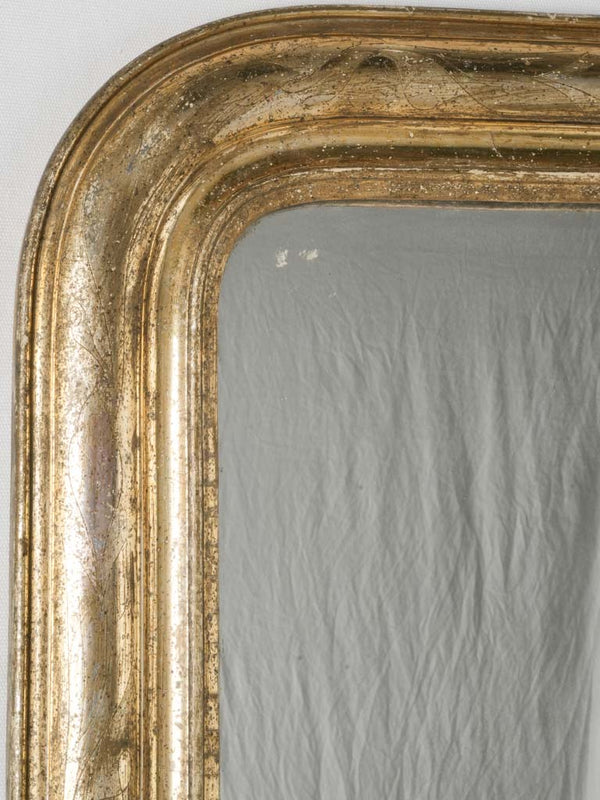 Intricate, silvery-gold 19th century mirror