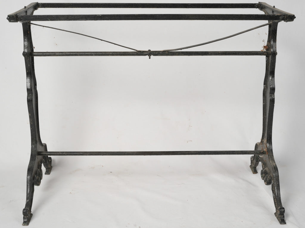 Aged, ornate black bistro table base
