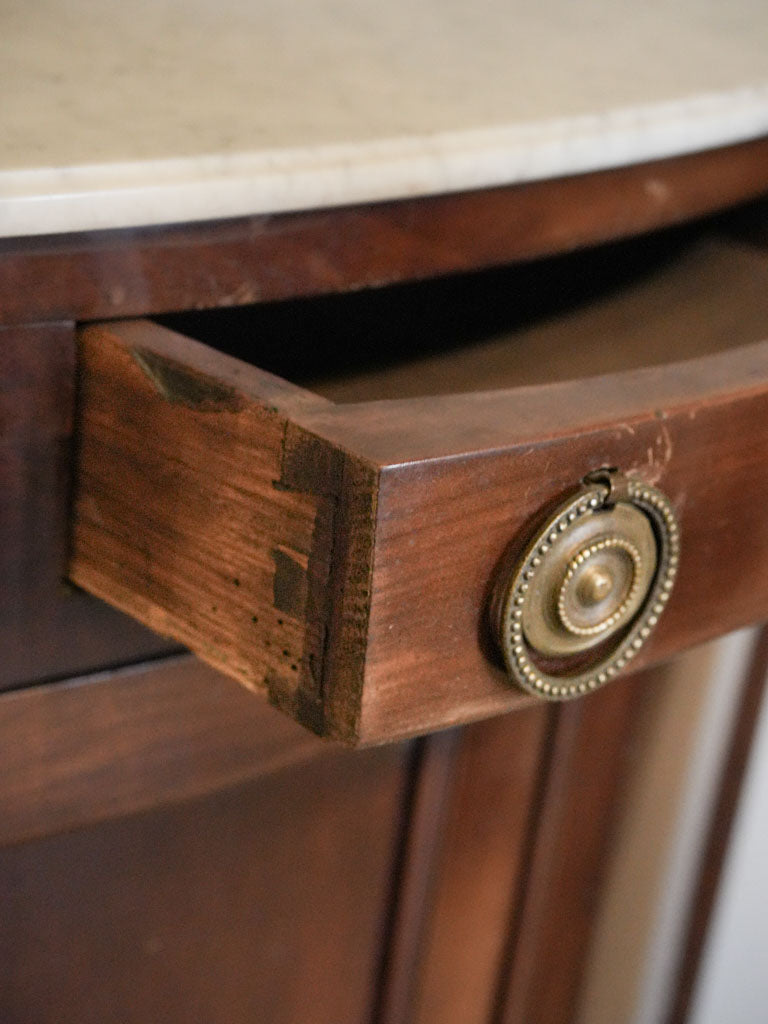 Refined marble-topped cabinets