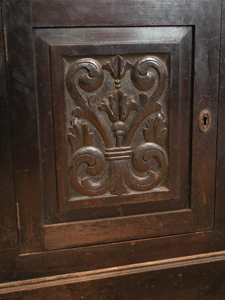 Symmetrical foliate motif bookcase  