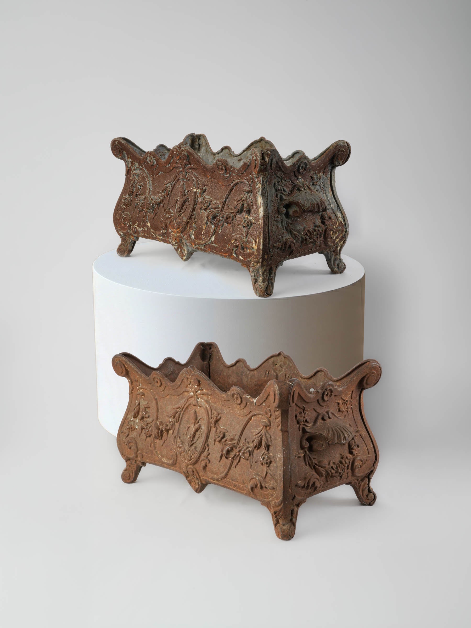 Elegant antique cast iron jardinieres  